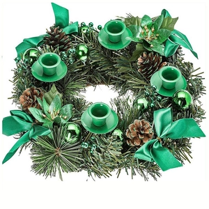 Christmas wreath candle holder with pine needles, cones, green ribbons and four metal bases