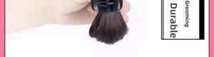 Detail showing the claw clip attachment on black messy bun hair extension piece