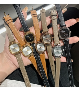 Detail view of women's square quartz watches with various colorful leather straps