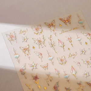 Gilded butterfly nail art stickers with watercolor flower patterns and gold metallic edges