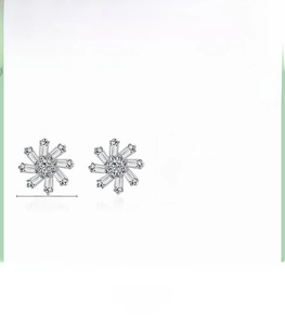 Macro detail of S925 silver snowflake stud earrings measuring 8.7mm with zirconia