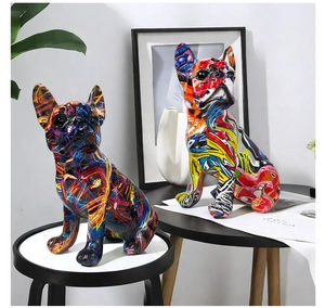 Artistic graffiti style French Bulldog resin statues displayed in a home decor setting