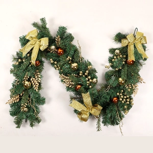 Christmas PVC garland with golden baubles and glitter bows on white background