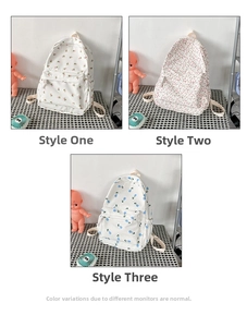 Detailed comparison of student backpacks in three floral prints: pink and blue tulips