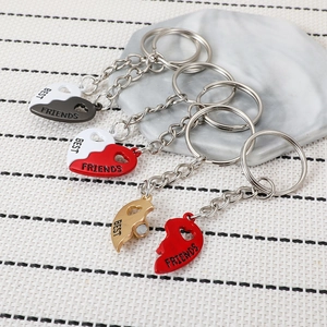 Three pairs of magnetic heart best friends keychains in black, red and gold metal finish