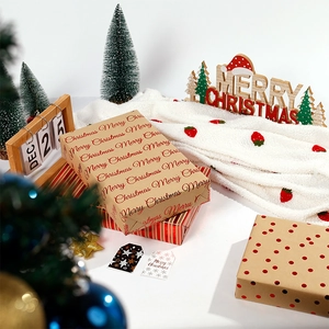 Christmas kraft wrapping paper set with Merry Christmas lettering and festive patterns