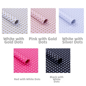 Close-up of five polka dot tissue paper styles for elegant gift and bouquet packaging