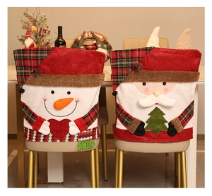 Detailed view of Christmas chair covers with plush 3D Santa and snowman designs