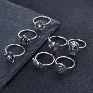 7-piece vintage stainless steel ring set with sunflower, skull, and rose motifs