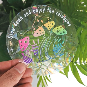 Macro detail of holographic mushroom suncatcher sticker with rainbow prism effect