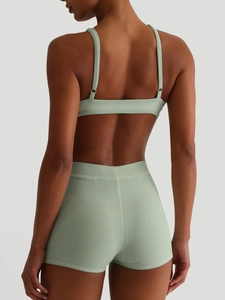 Women's light green ribbed workout set featuring a sports bra and shorts back view