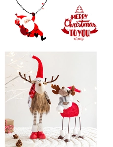 Close-up of plush reindeer figurines with red knit sweaters and striped scarves