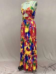 Close-up of vibrant artistic print on sexy halter maxi dress with cutout waist detail