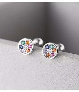 Macro shot of 925 silver cross stud earrings with colorful rainbow cubic zirconia