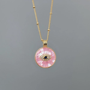 Gold chain necklace with pink shell pendant featuring a zircon Evil Eye design