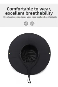 Detail view of black wide brim sun hat showing breathable mesh lining and adjustable chin strap