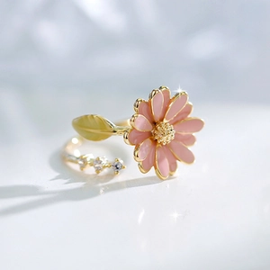 Golden daisy open ring with pink enamel petals and sparkling zircon leaf detail