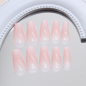 Pink gradient long coffin press-on nails set with glossy finish on reflective mirror