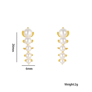Minimalist pearl earrings set in gold with size dimensions 26mm by 6mm on white backdrop