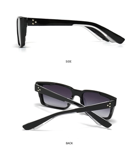 Detail view of black square sunglasses with gold star rivets on side and back frames