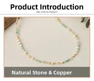 Detail of colorful natural stone beaded necklace with golden copper spacer beads