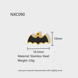 Detail of a black bat pendant in gold stainless steel with precise size measurements