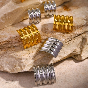Square ribbed 18k gold and silver stainless steel earrings on a natural stone surface