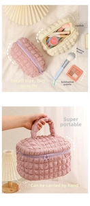 Detailed macro view of embossed bubble texture fabric on large cosmetic bags