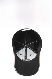 Detailed interior of black baseball cap showing reinforced stitching and classic embroidery