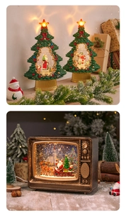 Detail of Christmas lantern snow globe with glowing LED light and festive tree scene