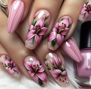 Close-up of pink almond press-on nails with lily floral art and 3D embossed texture