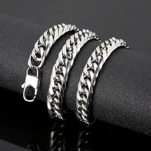 Men's chunky silver stainless steel Cuban link bracelet with lobster clasp on black background