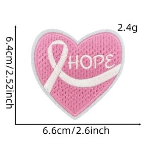 Macro shot of Hope pink heart embroidery patch with ribbon and detailed stitch texture