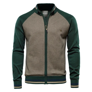 Detail of men's color-block knit cardigan with stand collar and zipper texture