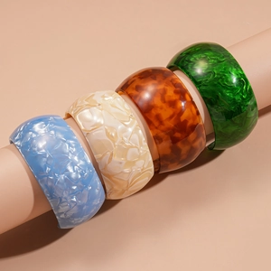 Iridescent geometric resin bangles in marble and tortoiseshell patterns for women
