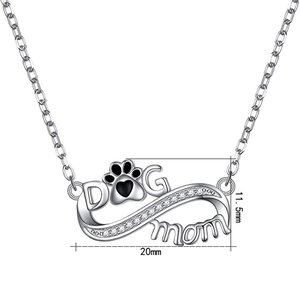 Detailed macro view of S925 silver MOM and DOG pendant with white zircon and infinity paw