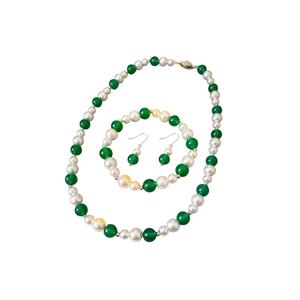 Vintage jewelry set with pearl and green agate necklace, bracelet and earrings on white background