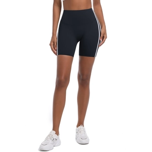 Close-up of high-waisted black yoga shorts with side stripes and breathable fabric