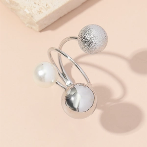 Adjustable multi-layered ring featuring silver beads and white pearl on a minimal base