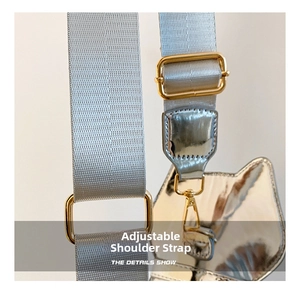 Detail of adjustable strap with cat ear shape leather and golden metal buckle
