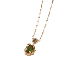 Gold plated necklace with green zircon butterfly pendant and vintage court style detail