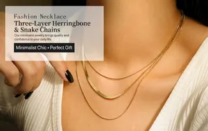 Close-up of triple-layered gold-plated snake chains on a female model neck
