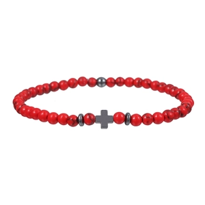 Mens red turquoise beaded bracelet featuring a dark grey hematite cross charm