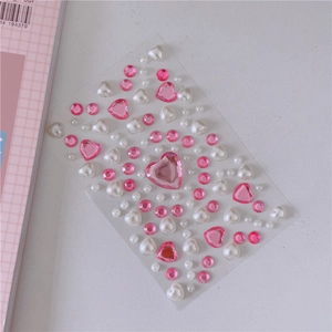 Detail of pink crystal rhinestones and white heart pearls for DIY girl decorations
