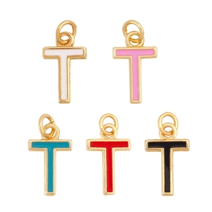 Detail view of five T-shaped gold pendants in white pink blue red and black colors