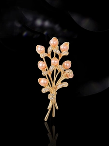 Detailed view of wheat ear brooch with pink freshwater pearls and sparkling cubic zirconia
