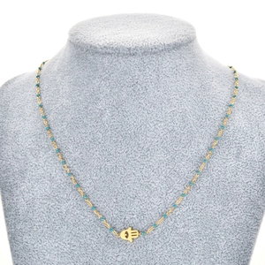 Collier Main de Fatma dorée avec perles turquoise et pendentif oeil sur buste à bijoux