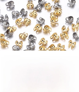 Macro detail of gold and silver bead tips for jewelry making with product specifications
