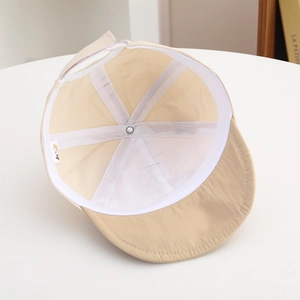 Detail of baby sun hat interior showing breathable fabric and adjustable strap