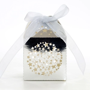 Close-up of silver mirror gift box with laser-cut stars and light blue organza ribbon